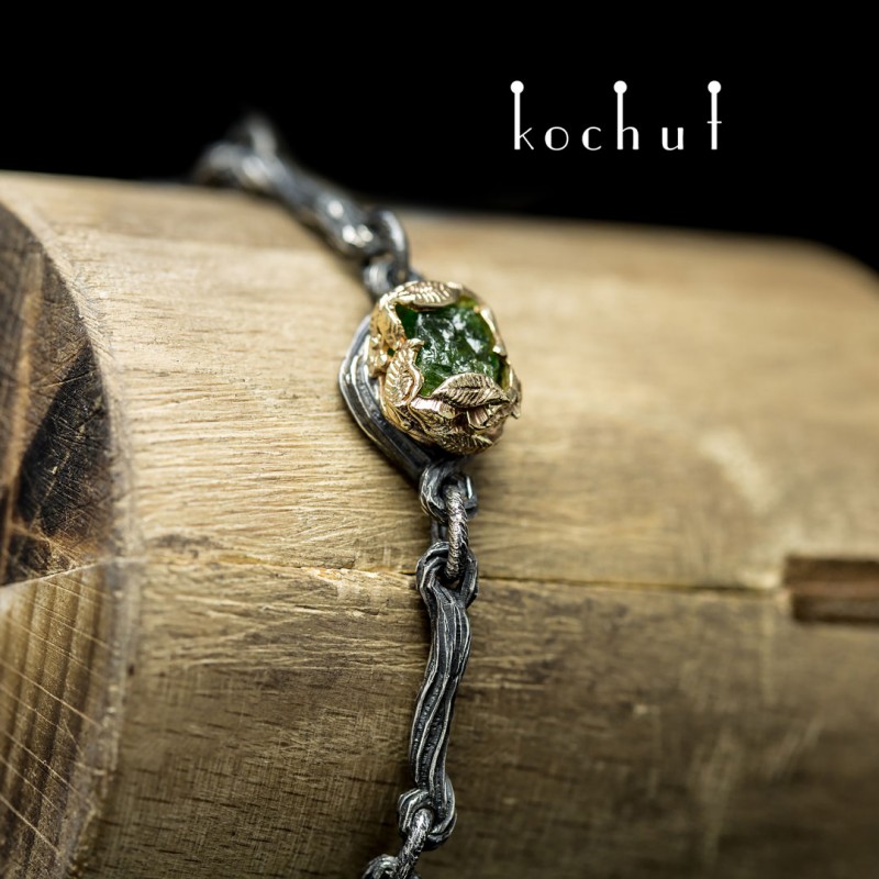 Bracelet "The source of life." Silver, gold, crystal of green garnet