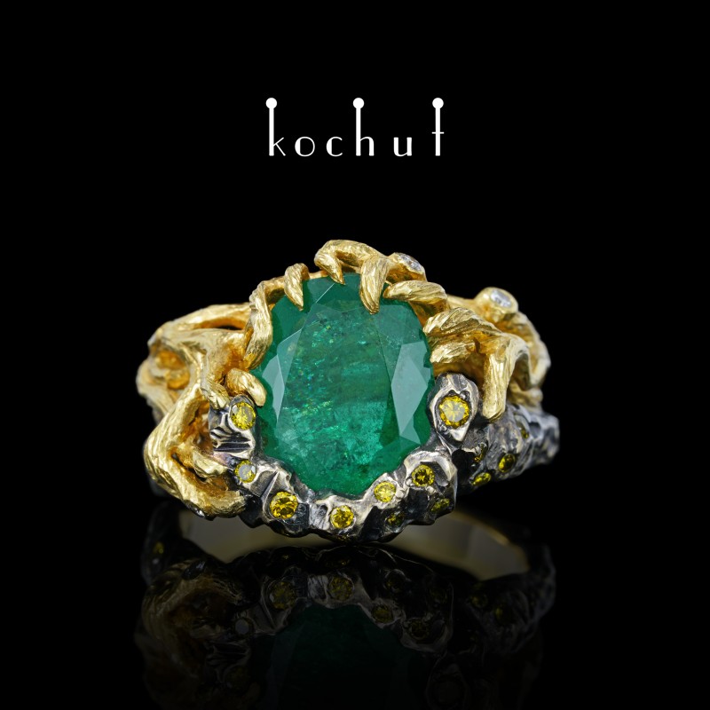 Dominant — golden ring with emerald and diamonds
