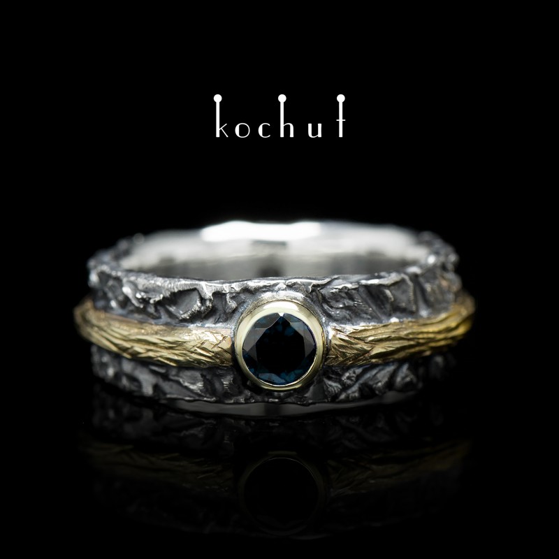 Обручальное кольцо «Цитадель». Серебро, желтое золото, топаз london blue