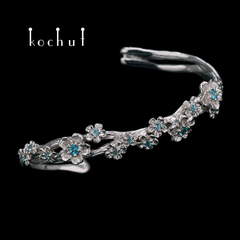 Bracelet «Floral». Silver, white rhodium, topazes