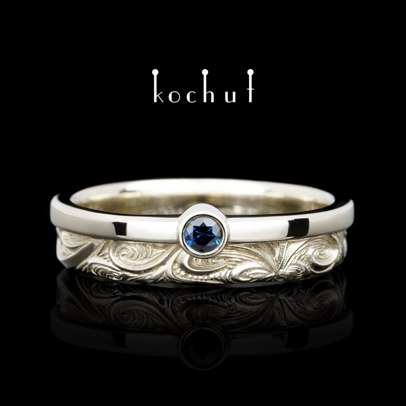 Wedding ring «In joy and sorrow: halves». White gold, sapphire
