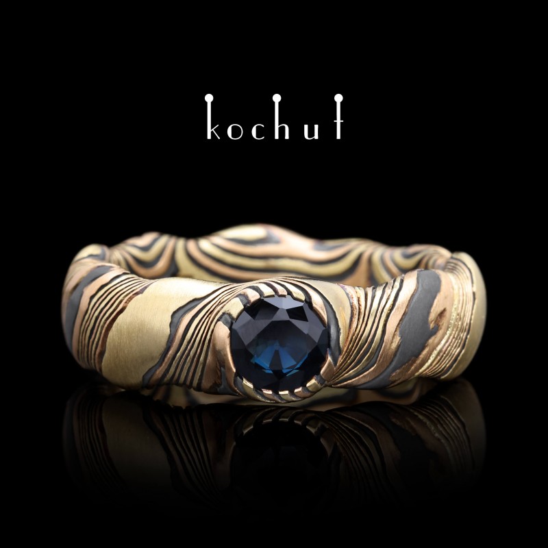 Seamless ring mokume «Polar lights». Red and yellow gold, silver, oxidation, sapphire