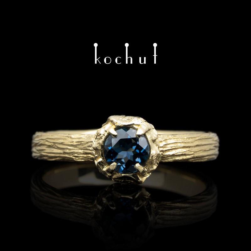 Ring «Sun Forest». Yellow gold, topaz London Blue