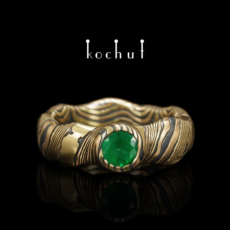 Seamless ring mokume «Polar lights». Red and yellow gold, etched silver, emerald, oxidized