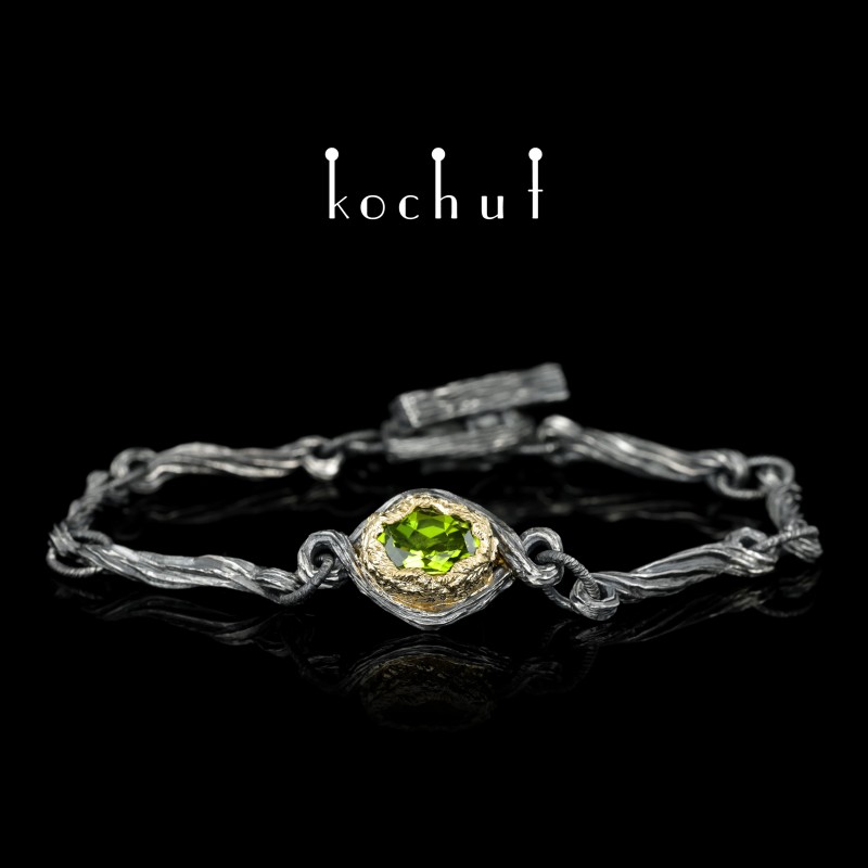Bracelet "The source of life." Silver, gold, crystal of green garnet