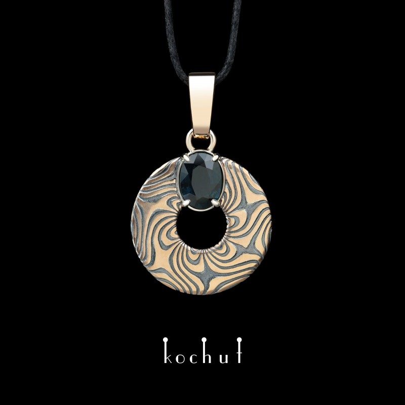 Mokume pendant «Precious astrolabe». Red and white gold, etched silver, sapphire, oxidized