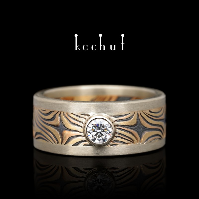 Wedding ring mokume «Shining of the Eastern Starss.» White, yellow, red gold, etched silver, diamond, oxidized