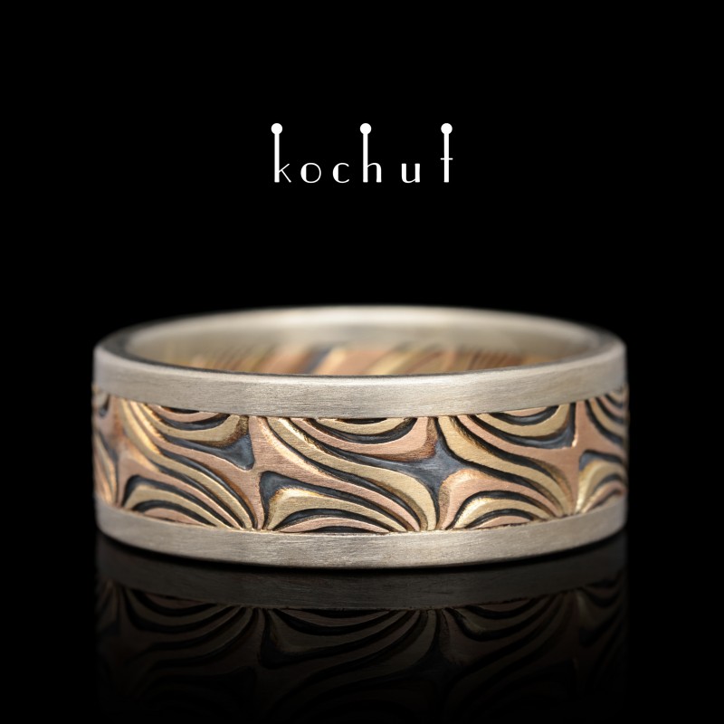 Mokume wedding ring "Shining of the Eastern Stars". White, yellow, red gold, etched silver, oxidation