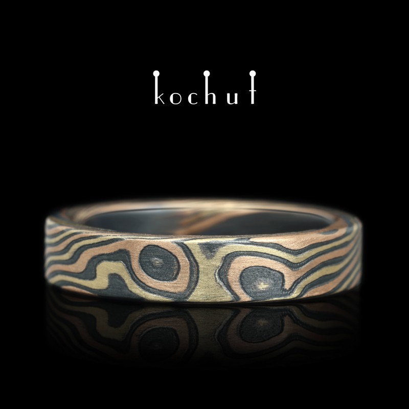 Mokume wedding ring «Kanso». Red and yellow gold, etched and oxidized silver