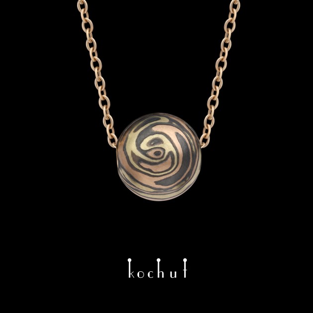 Mokume pendant «Whirlwind». Yellow, red gold, etched and oxidized silver