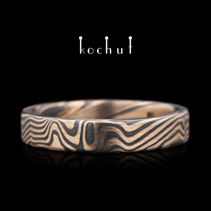 Mokume wedding ring «Kanso». Etched silver, red gold, oxidized